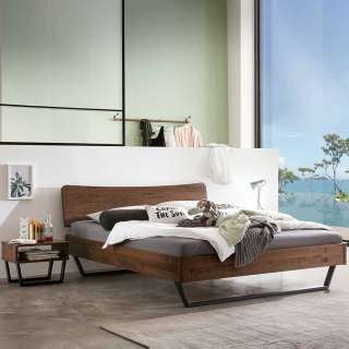 Massivholz Bett mit Bügelgestell aus Nussbaum Massivholz Stahl