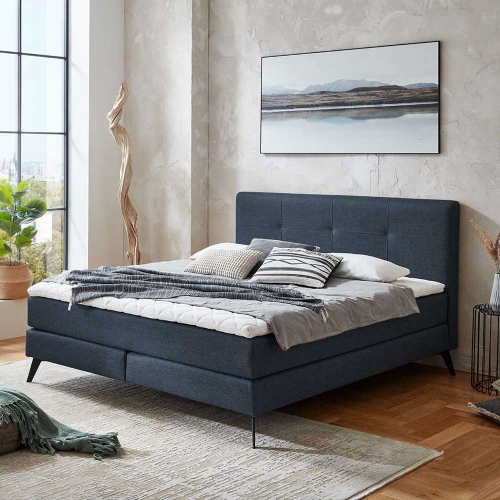 Springboxbett Dunkelblau aus Webstoff Vierfußgestell aus Metall